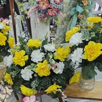 Yellow and white carnation sympathy arrangement