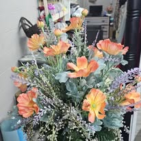 Peach poppy and dusty miller arrangement