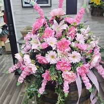 Tall pink snapdragon and gerbera daisy memorial spray